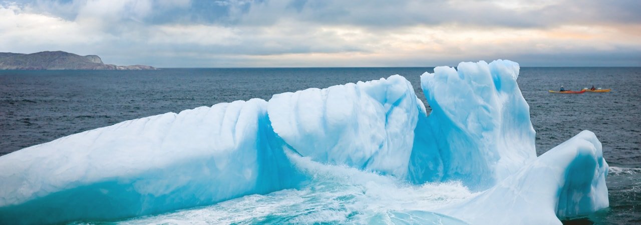 Iceberg and kayakers in Newfoundland and Labrador