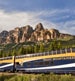 Rocky Mountaineer train passing by Castle mountain