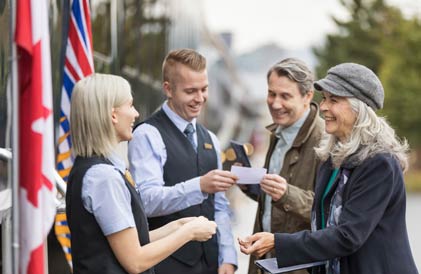 Group of people talking to a train guide